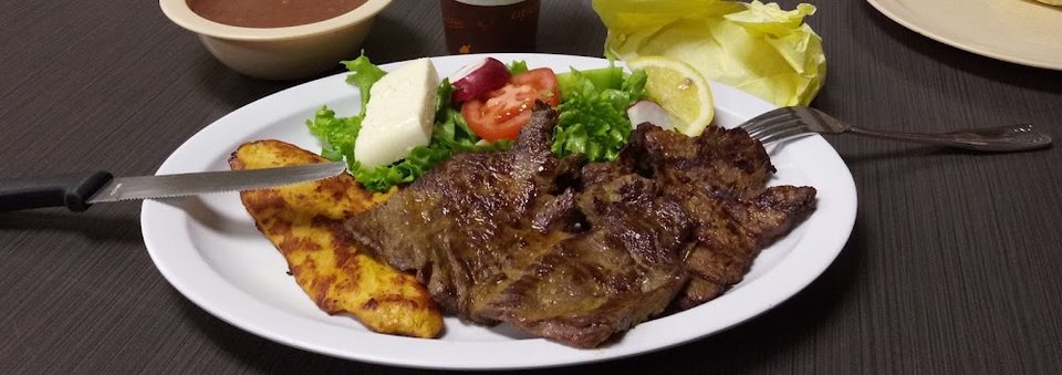 Printed menu featuring Salvadoran specialties.